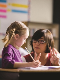 Teacher with elementary school student